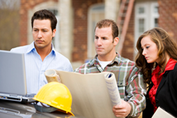 realtor and clients on building lot